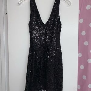 Black sequin dress with feather trim!